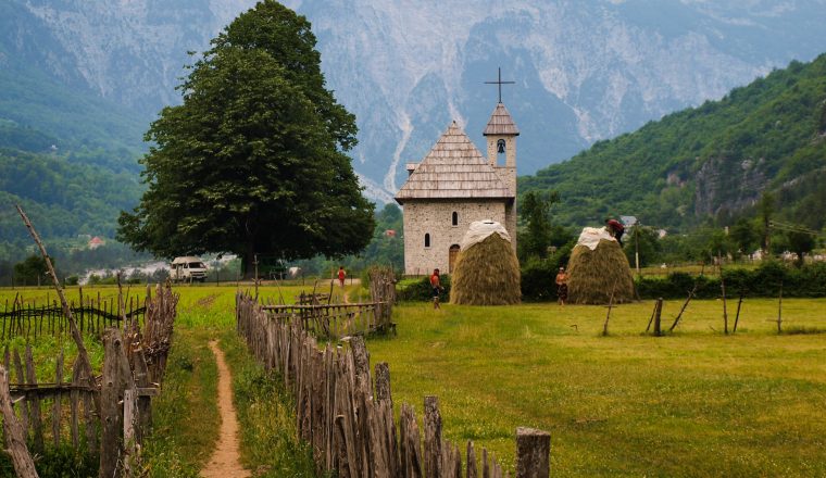 Center of Theth with reconstructed church during harvest time